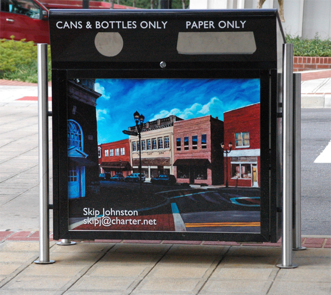 Recycling bin with "Trade Street" graphic.