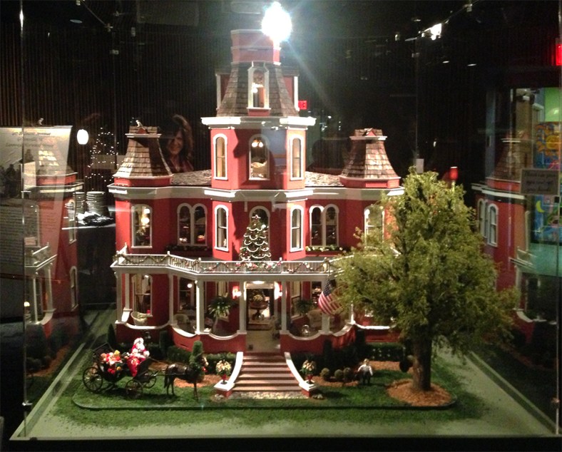 The Norwood-Lanneau dollhouse, all decked for the Holidays, in the Christmas Room at Greenville County's Children's Museum.